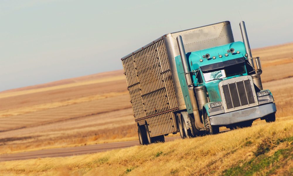 Semi Truck on the American Prairie Road in Colorado. United States of America. Trucking and Shipping Theme.