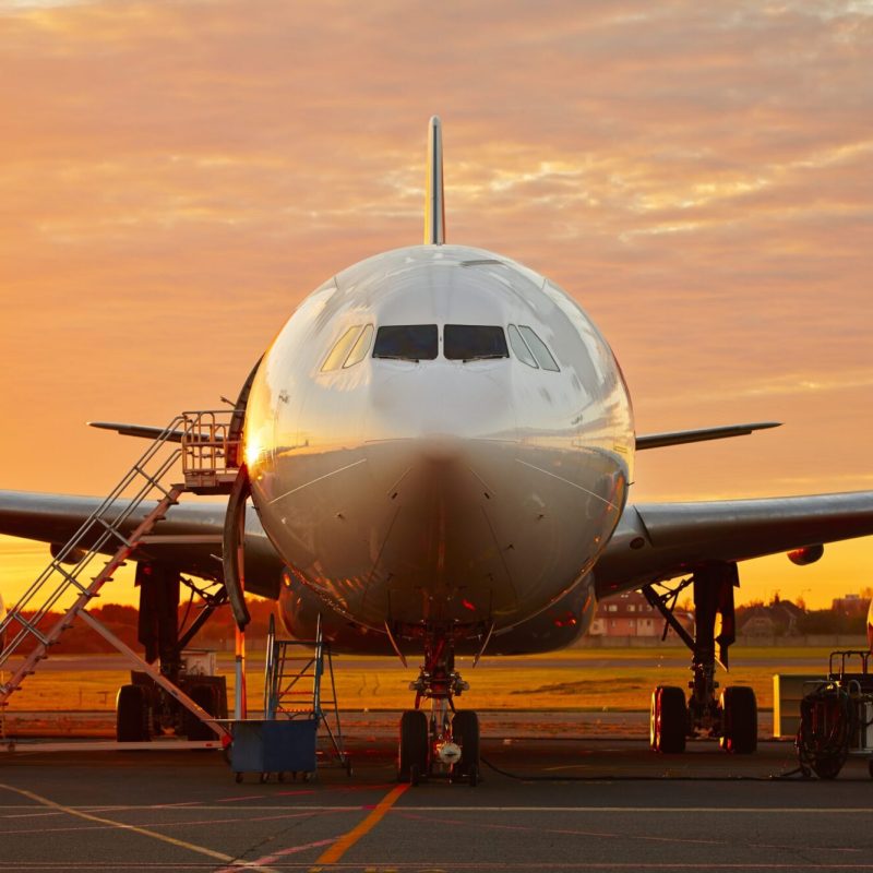 Aircraft service - large aircraft at the beautiful sunrise
