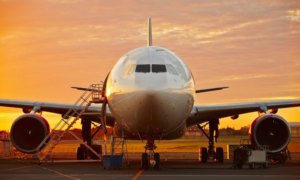 Aircraft service - large aircraft at the beautiful sunrise